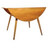 ERCOL - A MID CENTURY BEECH AND ELM TOPPED DINING TABLE