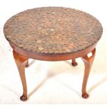 VINTAGE WALNUT AND COIN TOPPED COFFEE TABLE