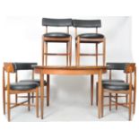G PLAN ROUND EXTENDING TABLE AND SIX MATCHING CHAIRS