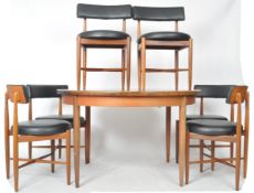 G PLAN ROUND EXTENDING TABLE AND SIX MATCHING CHAIRS