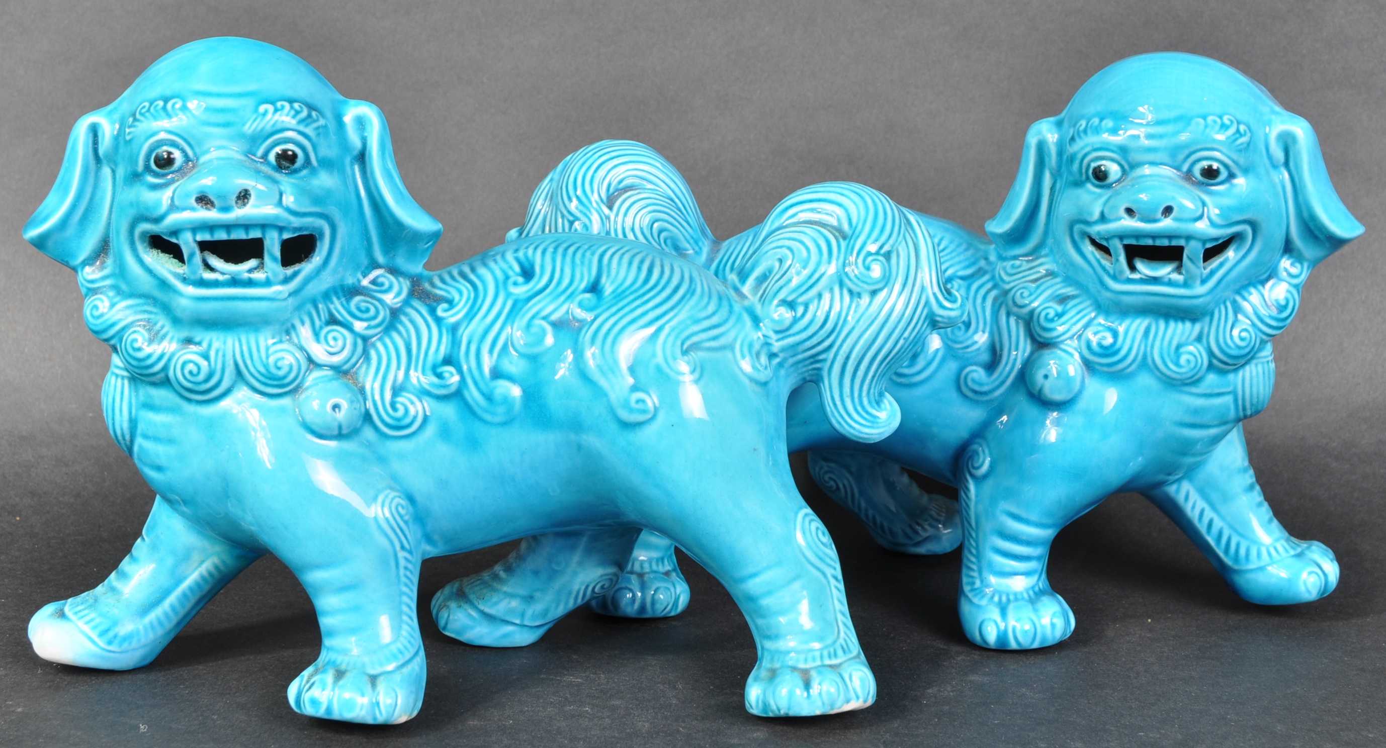 MATCHING PAIR OF BLUE GLAZED CERAMIC DOGS OF FOE