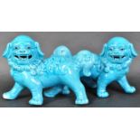 MATCHING PAIR OF BLUE GLAZED CERAMIC DOGS OF FOE