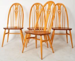 ERCOL - SWAN PATTERN - SET OF FOUR LIGHT DINING CHAIRS