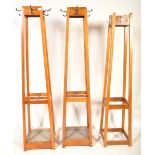 MATCHING PAIR OF MID CENTURY OAK FRAMED COAT HOOKS