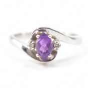 9CT WHITE GOLD PURPLE STONE & DIAMOND CROSSOVER RING