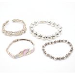 FOUR VINTAGE SILVER BRACELETS