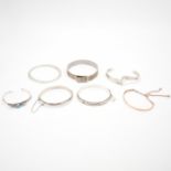 GROUP OF SEVEN SILVER BANGLE BRACELETS