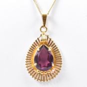 HALLMARKED 9CT GOLD CHAIN & YELLOW METAL & PURPLE STONE PENDANT