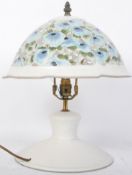 A CONTEMPORARY PIERCED WHITE FLORAL TABLE LAMP