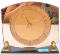 AN ART DECO PEACH MANTEL CLOCK