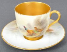 A CIRCA 1920S ROYAL WORCESTER COFFEE CUP & SAUCER BY J STINTON