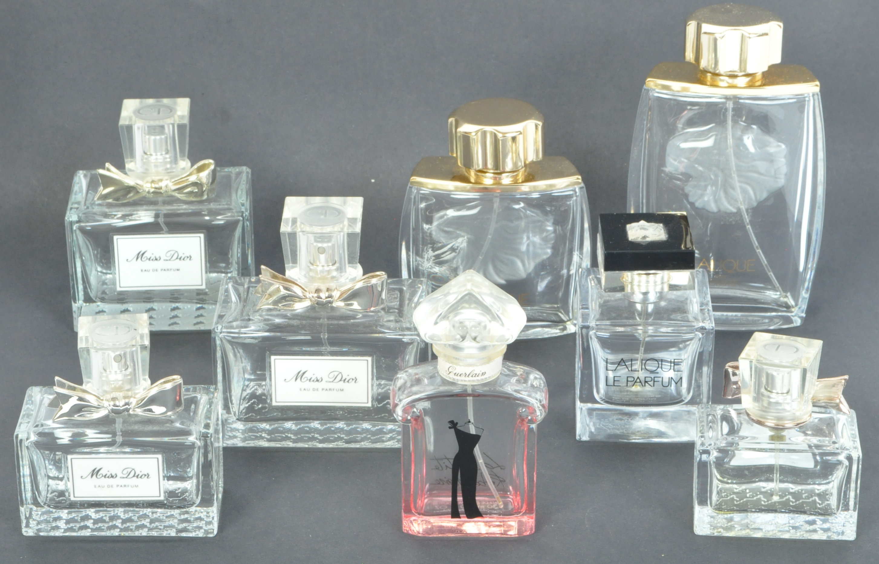 A COLLECTION OF LALIQUE BRANDED PERFUME BOTTLES