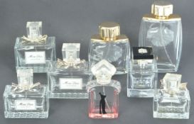 A COLLECTION OF LALIQUE BRANDED PERFUME BOTTLES