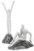 A PAIR OF ABSTRACT HUMAN SCULPTURE FIGURINES