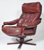 A RETRO CIRCA 1980S BURGUNDY LEATHER SWIVEL ARMCHAIR