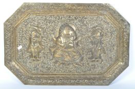 AN INDIAN EMBOSSED BRASS WALL HANGING / TRAY