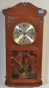 EARLY 20TH CENTURY - CIRCA 1930S - OAK GRANDDAUGHTER WALL CLOCK