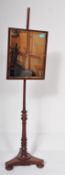 AN EARLY 20TH CENTURY OAK MIRROR ON TRIPOD STAND