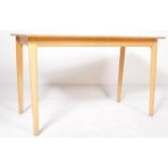 A RETRO MID 20TH CENTURY TEAK WRITING TABLE