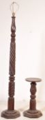 A MAHOGANY CARVED STANDARD LAMP WITH A WINE TABLE