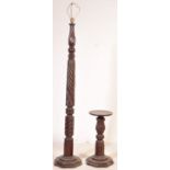 A MAHOGANY CARVED STANDARD LAMP WITH A WINE TABLE