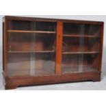 A RETRO CIRCA 1980S OAK BOOKCASE WITH TWIN GLAZED DOORS