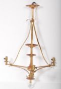 AN EARLY 20TH CENTURY TALL BRASS TIERED CEILING LIGHT