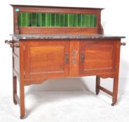 A VICTORIAN OAK WASHSTAND WITH GREEN GALLERY TILE TOP