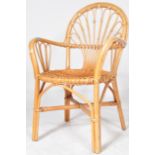 A RETRO MID 20TH CENTURY BAMBOO & RATTAN GARDEN ARMCHAIR