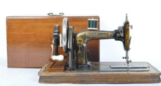 A 20TH CENTURY FRISTER & ROSSMANN SEWING MACHINE WITH CASE