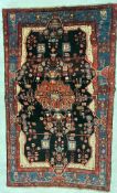 AN EARLY 20TH CENTURY PERSIAN ISLAMIC NAHAVAND FLOOR CARPET RUG