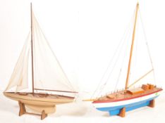 A PAIR OF WOODEN MODEL SAILING BOATS / POND YACHTS