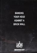 BANKSY (B.1974) - BANGING YOUR HEAD AGAINST A BRICK WALL