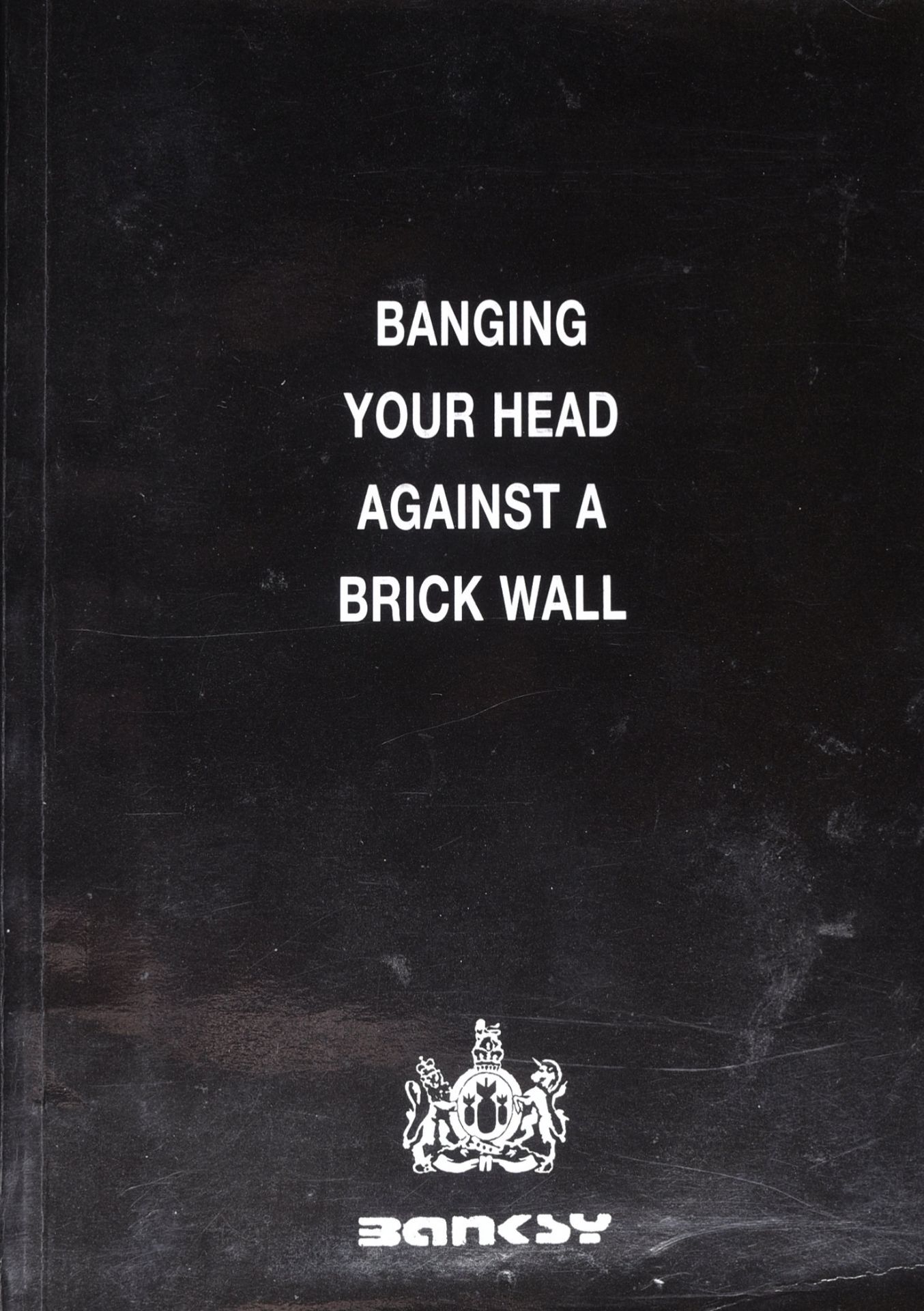 BANKSY (B.1974) - BANGING YOUR HEAD AGAINST A BRICK WALL