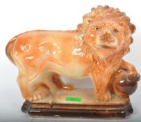 VICTORIAN TREACLE GLAZED PORCELAIN MEDICI LION SCULPTURE