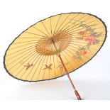 A WOODEN ORIENTAL CHINESE PARASOL