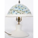 A CONTEMPORARY PIERCED WHITE FLORAL TABLE LAMP