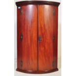 EARLY 19TH CENTURY GEORGE III BOW FRONT MAHOGANY CORNER CABINET