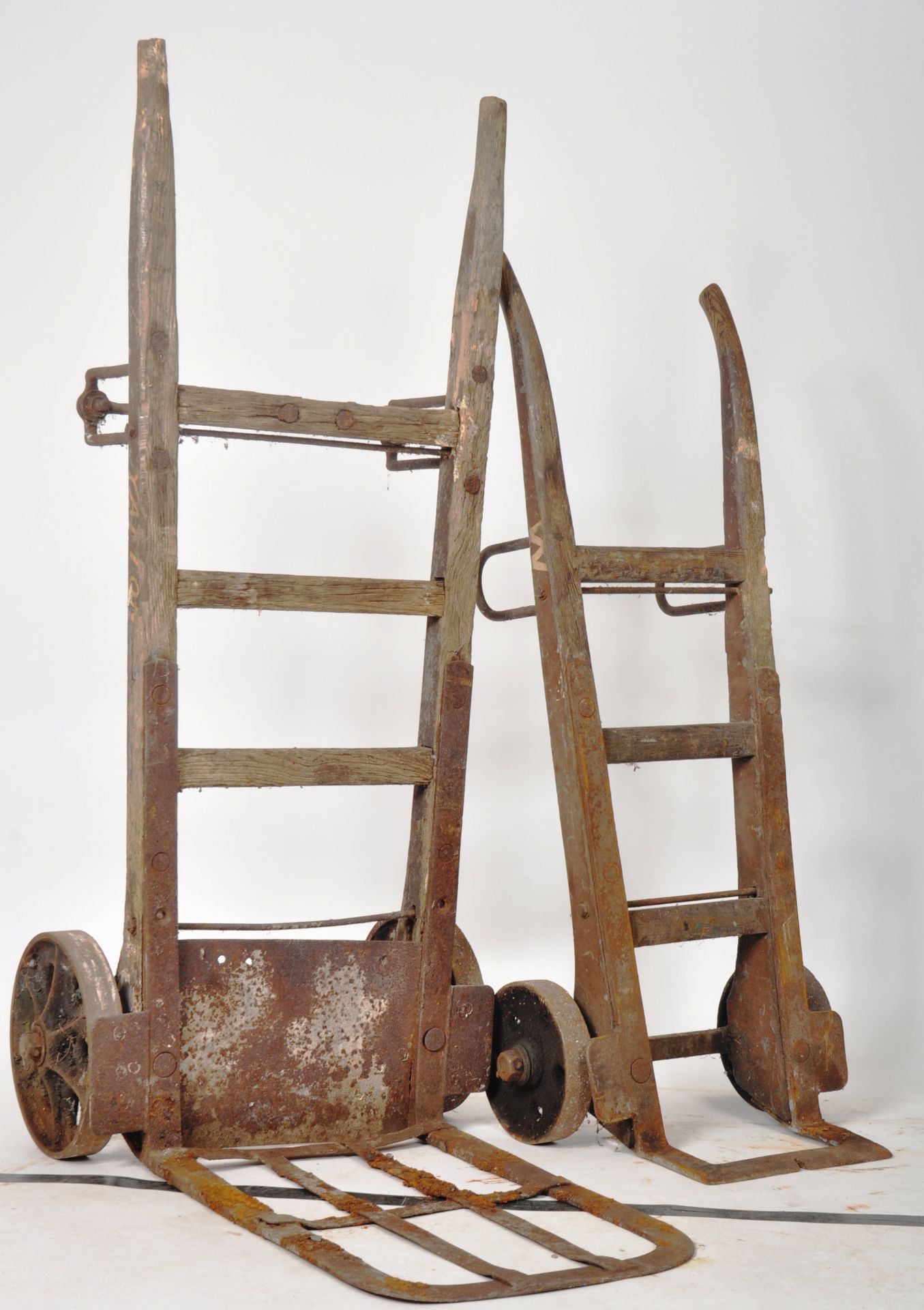 A PAIR OF VINTAGE RAILWAY SACK TRUCK TROLLIES