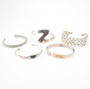 FIVE ASSORTED SILVER BANGLES