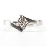 HALLMARKED PLATINUM & DIAMOND CROSSOVER RING