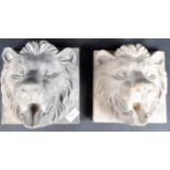 TWO EARLY 20TH CENTURY COMPOSITE LION WALL PLAQUES