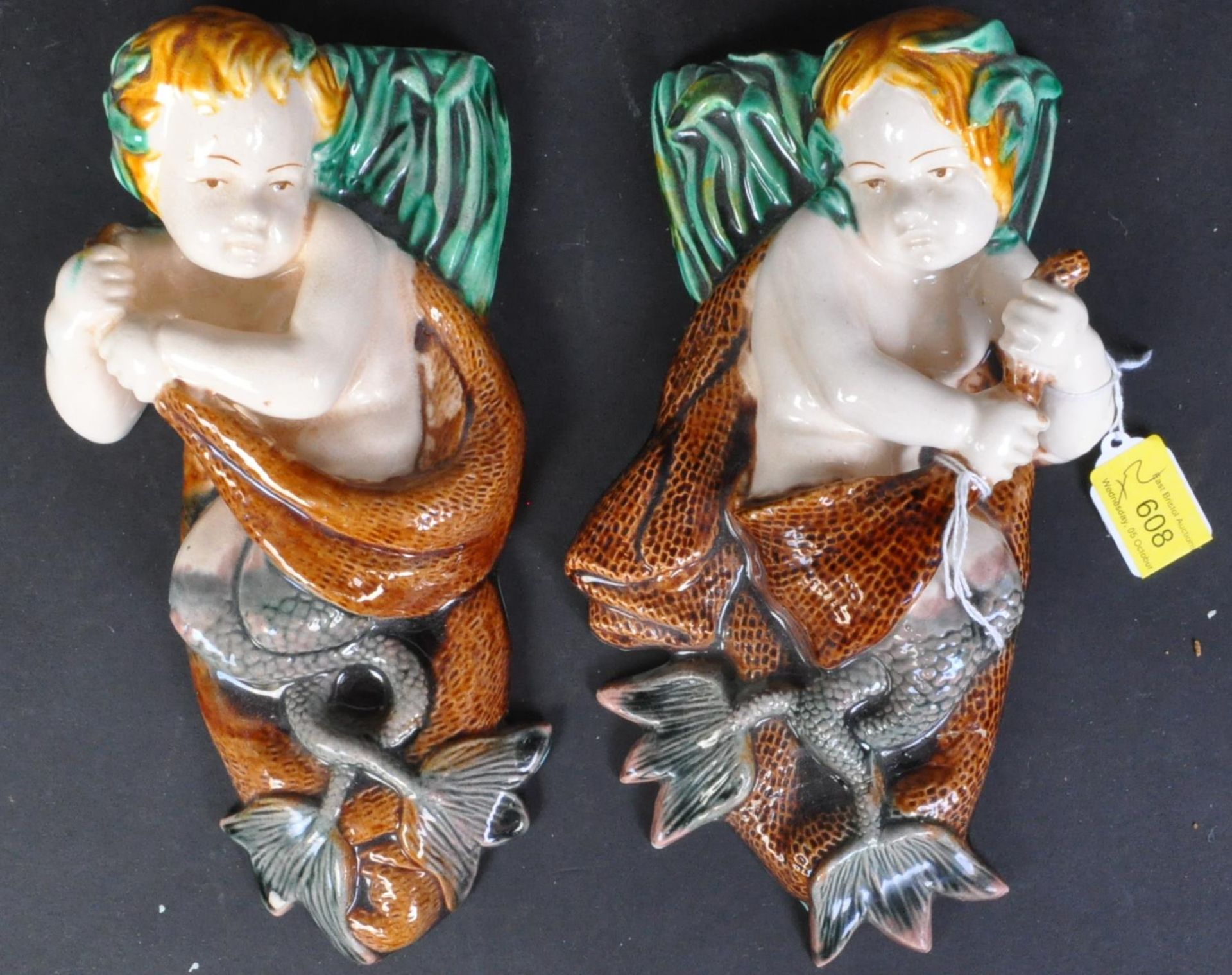 TWO EARLY 20TH CENTURY MAJOLICA CERAMIC WALL PLAQUES