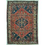 AN EARLY 20TH CENTURY PERSIAN ISLAMIC HERIZ FLOOR CARPET RUG