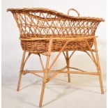 A RETRO VINTAGE CANED WICKER BAMBOO MOSES BASKET