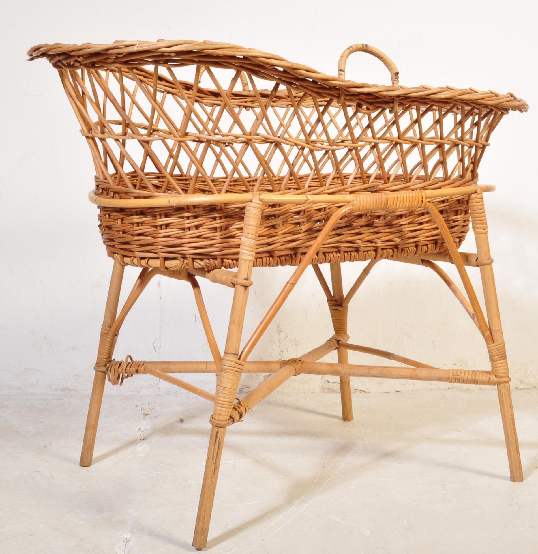 A RETRO VINTAGE CANED WICKER BAMBOO MOSES BASKET