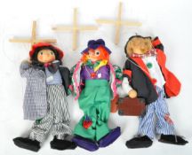 A COLLECTION OF THREE WOODEN CLOWN PUPPETS