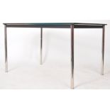 MANNER OF LE CORBUSIER - LC10 - CHROME AND GLASS DINING TABLE