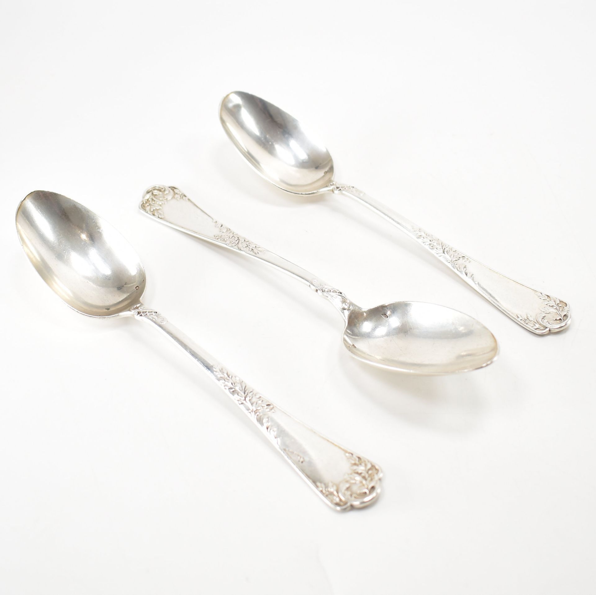 THREE ANTIQUE SILVER WHITE METAL SERVING SPOONS