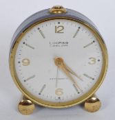 VINTAGE MID CENTURY ENAMELLED LOOPING ALARM CLOCK